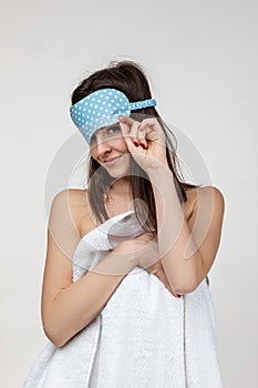 Young caucasian woman in eyemask photo