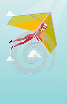 Young caucasian woman flying on hang-glider.