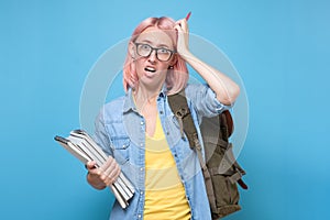 Young caucasian woman with glasses scratching head, thinking deeply about something