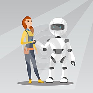 Young caucasian woman handshaking with robot.