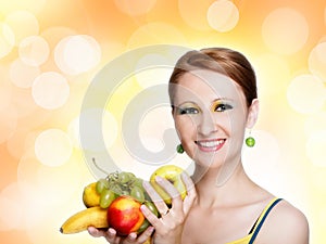 Young caucasian woman holding fruit