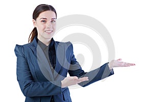 Young Caucasian woman holding her arm out and showing copy space for product. Isolated over white background.