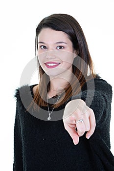 Young caucasian woman isolated on a white background pointing forward at you