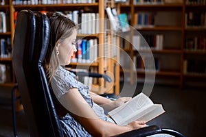 Young caucasian woman is keen on reading