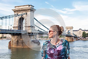 Young Caucasian woman looking away at Chain Bridge, Budapest, Hungary