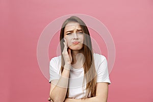 Young caucasian woman over isolated background touching mouth with hand with painful expression because of toothache