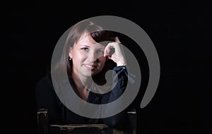 Young caucasian woman portrait on black background in studio