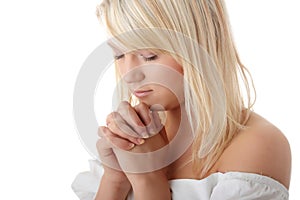 Young caucasian woman praying