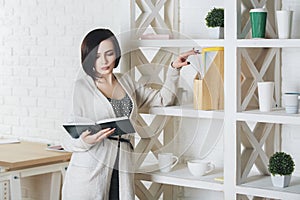 Young caucasian woman reading book