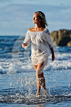 Young caucasian woman refreshing on summer evening