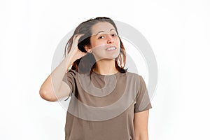 A young Caucasian woman is scratching her hair from dandruff and irritation. White background. The concept of hair care