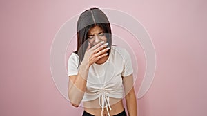 Young caucasian woman sneezing over isolated pink background