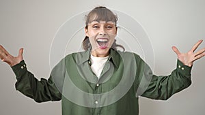 Young caucasian woman standing with surprise expression and raised arms over isolated white background