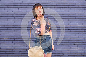 Young caucasian woman throwing kisses to the camera