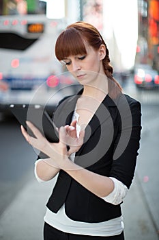 Young caucasian woman using tablet pc