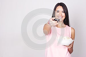 Young caucasian woman watching a movie / TV