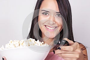 Young caucasian woman watching a movie / TV