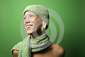 Young Caucasian woman wearing winter hat and scarf.