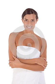 Young Caucasian woman wrapped in bath towel