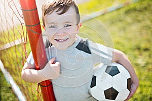 Young caucassian soccer player football