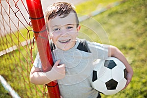 Young caucassian soccer player football