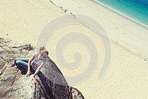 Young Caucassian woman on a white sandy beach in Luskentyre, Isle of Harris, Scotland