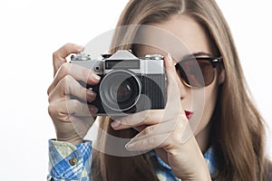 Young charming positive woman photographer with camera