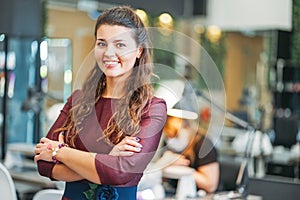 Young charming smiling woman owner of beauty salon nail bar, concept of own small business photo