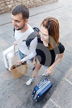 Young cheerful couple male and woman walking