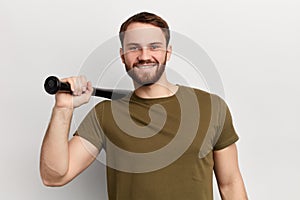 Young cheerful happy man wearing a green T shirt