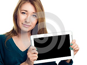 Young cheerful woman is showing blank tablet