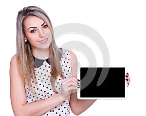 Young cheerful woman is showing blank tablet