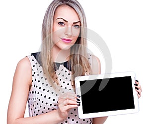 Young cheerful woman is showing blank tablet