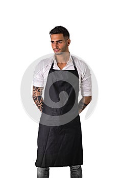 Young chef or waiter wearing black apron photo