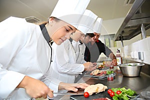 Young chefs preparing delicatessen