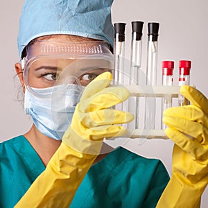 Young chemist student working in lab on chemicals