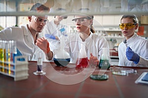 Young chemistry students work with dangerous chemicals in the university laboratory. Science, chemistry, lab, people