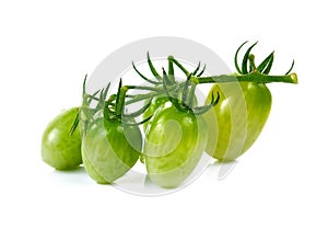 Young cherry tomatoes on white background.
