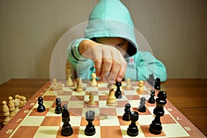 Young chess player plays chess