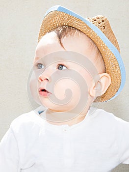 Young child boy with hat outdoor