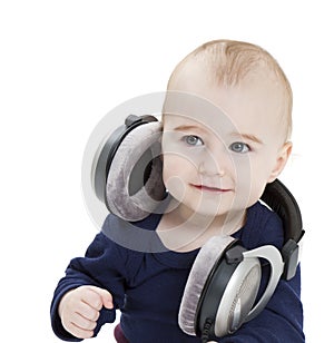 Young child with ear-phones listening to music