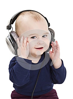 Young child with ear-phones listening to music