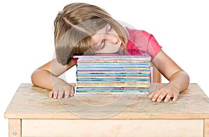 Young Child Falling Asleep on her Books