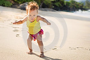 A young child having fun on the beach