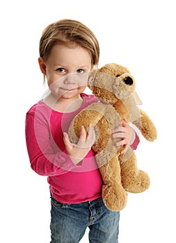 Young child holding a teddy bear