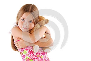 Young Child Hugging A Teddy Bear