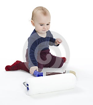 Young child with painters equipment