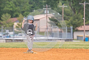 Young Child Playing Baseball