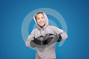 Young child sportsman in boxing gloves