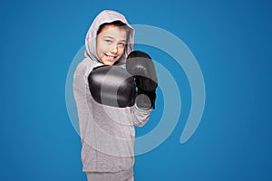 Young child sportsman in boxing gloves